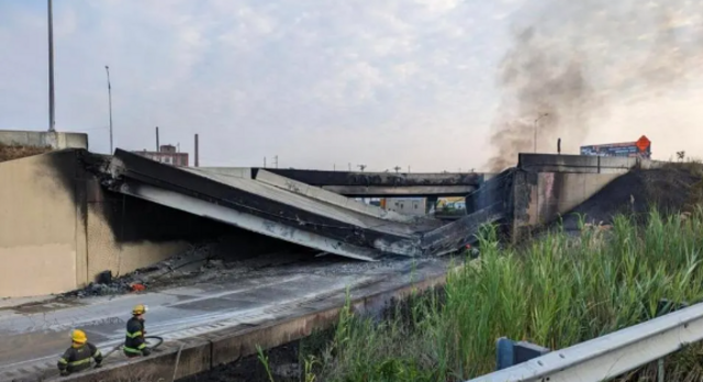 n this handout photo provided by the City of Philadelphia Office of Emergency Management, smoke rises from a collapsed section of the I-95 highway on June 11, 2023 in Philadelphia, Pennsylvania. According to reports, a tanker fire underneath the highway c
